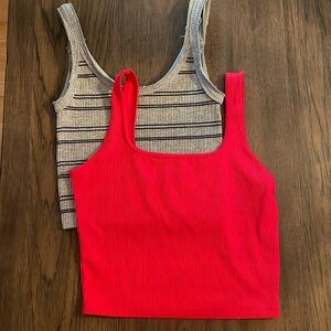 Pair of tank tops.